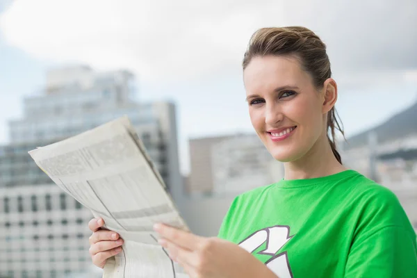 Environmental activist holding newspaper — Stock Photo, Image