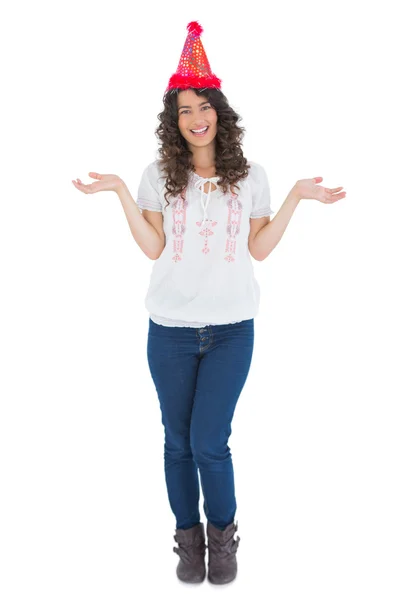 Cheerful casual brunette with party hat posing — Stock Photo, Image