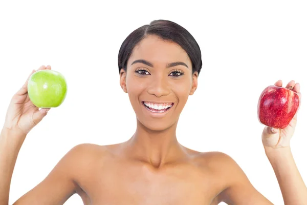 Smiling attractive model holding apples in both hands — Stock Photo, Image