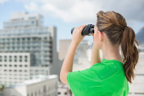 Rear view of woman wearing green recycling tshirt — Stock Photo, Image