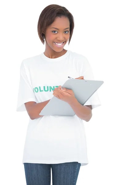 Smiling volunteer woman holding clip board — Stock Photo, Image