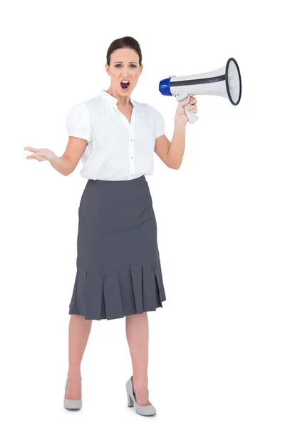 Stern businesswoman yelling in her megaphone — Stock Photo, Image