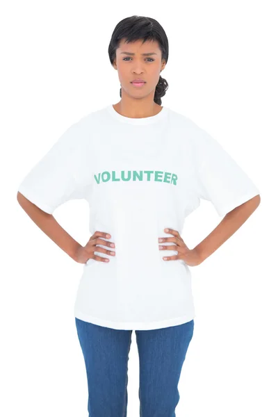 Irritated black haired volunteer posing with hands on the hips — Stock Photo, Image