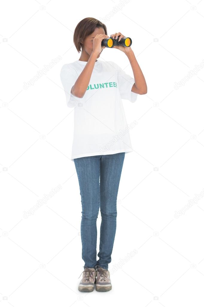 Volunteer woman looking through binoculars