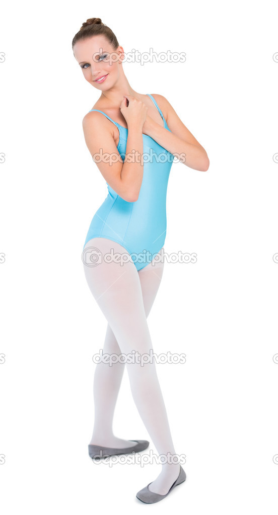 Content pretty ballerina posing with hands on the neck