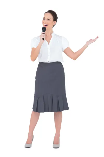 Cheerful presenter holding microphone — Stock Photo, Image