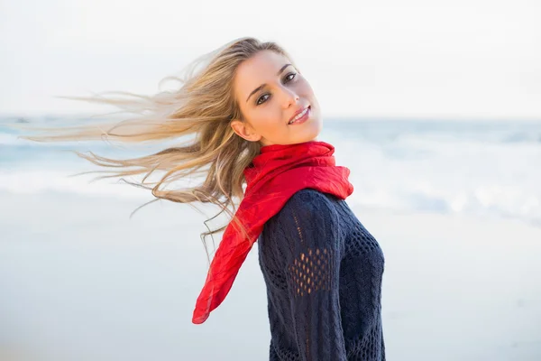 Smiling sexy blonde tossing her hair — Stock Photo, Image