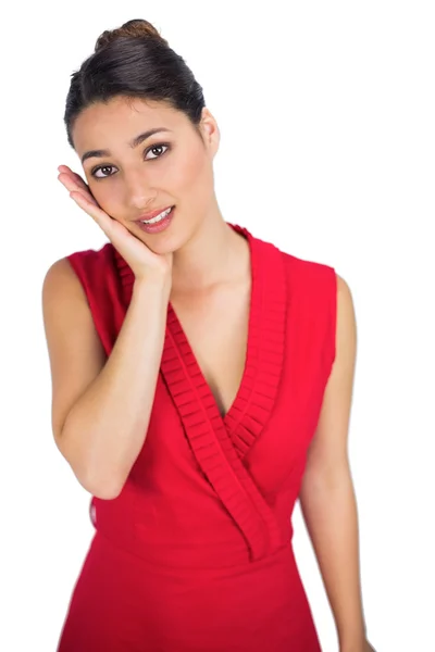 Worried sexy brunette in red dress posing — Stock Photo, Image