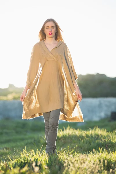 Attractive blonde woman wearing poncho — Stock Photo, Image