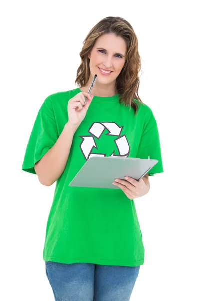 Smiling environmental activist holding clipboard looking at camera — Stock Photo, Image