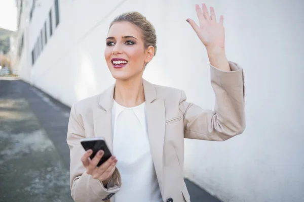 Cheerful attractive businesswoman waving — Stock Photo, Image