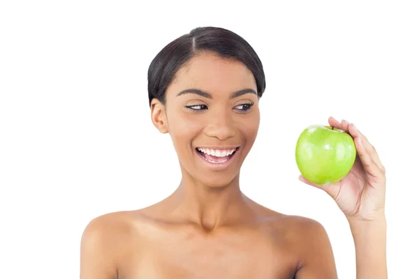 Smiling attractive model holding green apple — Stock Photo, Image