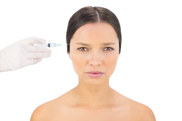 Serious bare model having botox injection — Stock Photo, Image