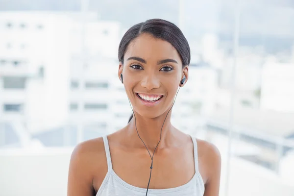 Cheerful pretty model listening to music — Stock Photo, Image