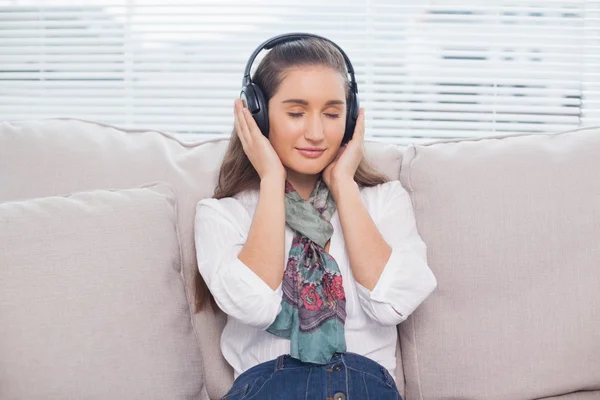 Peaceful cute model listening to music — Stock Photo, Image