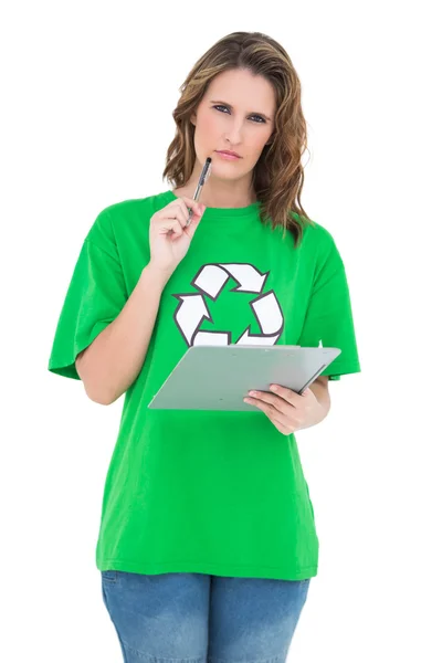 Thoughtful environmental activist holding clipboard — Stock Photo, Image