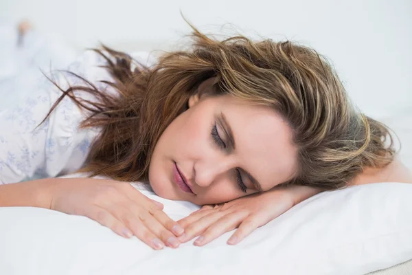 Close up view on woman sleeping in cosy bed — Stock Photo, Image