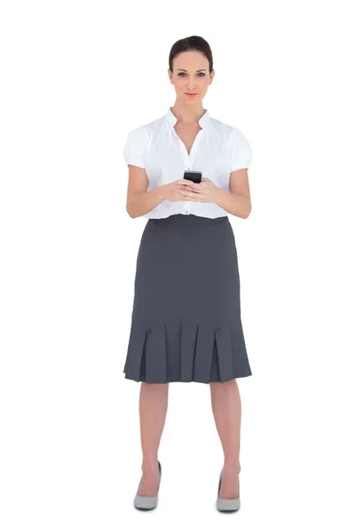 Content businesswoman sending a text message — Stock Photo, Image