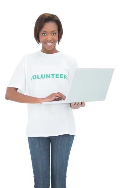 Smiling woman using laptop — Stock Photo, Image