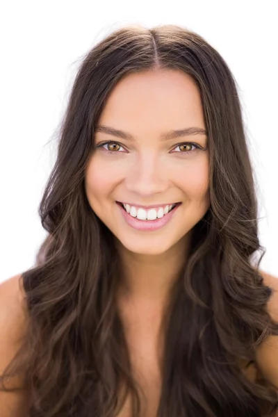 Beautiful young brunette smiling at camera — Stock Photo, Image