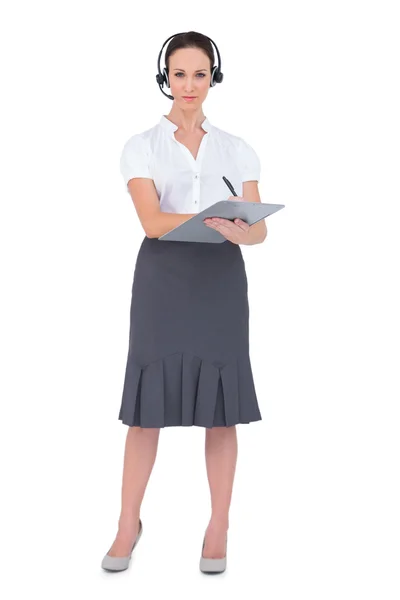 Pretty call center agent holding clipboard — Stock Photo, Image