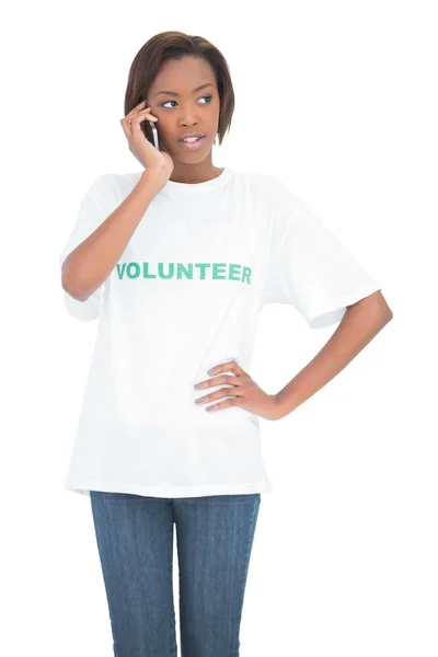 Thoughtful cute volunteer having a phone call — Stock Photo, Image