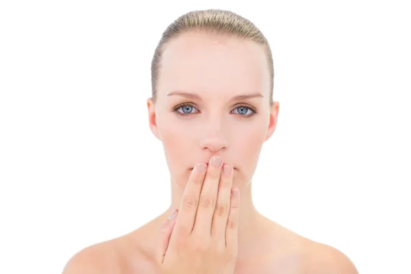 Serious pretty blonde model covering her mouth — Stock Photo, Image