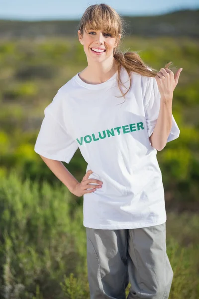 Smiling natural blonde wearing a volunteering t shirt — Stock Photo, Image