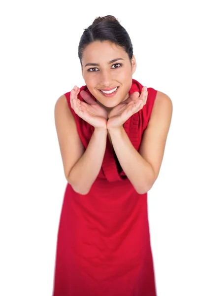 Surprised mysterious brunette in red dress posing — Stock Photo, Image