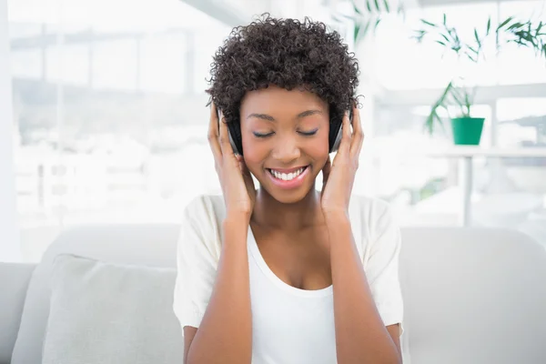Relaxed pretty woman listening to music — Stock Photo, Image