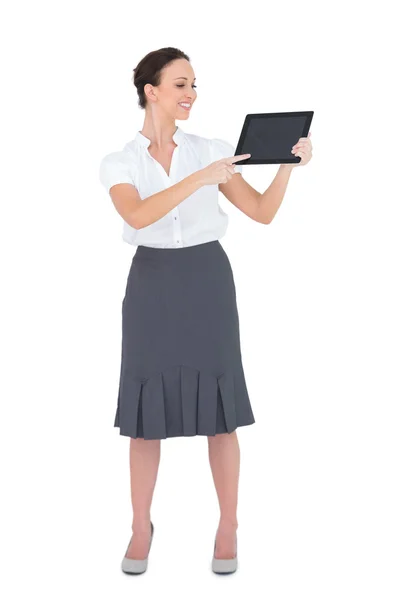 Cheerful businesswoman showing something on her tablet pc — Stock Photo, Image