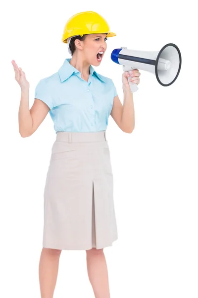 Stern attractive architect yelling in megaphone — Stock Photo, Image