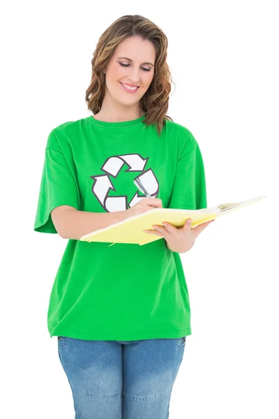 Happy environmental activist holding notebook — Stock Photo, Image