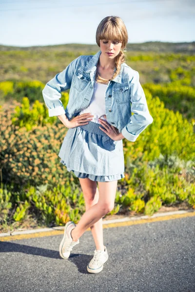 Trendy attractive blonde posing on the roadside — Stock Photo, Image