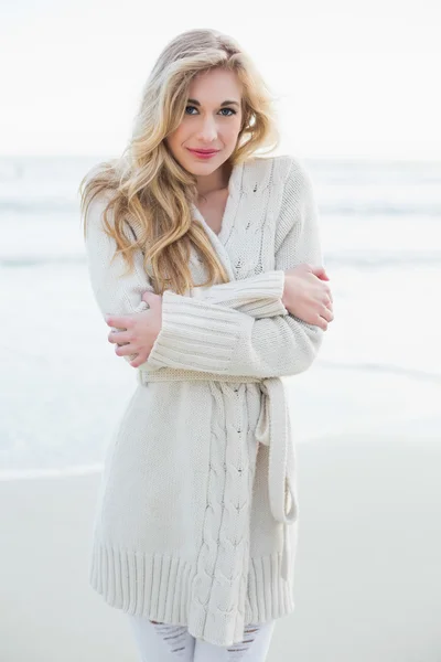 Attractive blonde woman in wool cardigan looking at camera — Stock Photo, Image