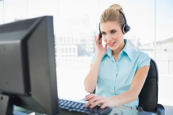 Focused call centre agent working on computer — Stock Photo, Image