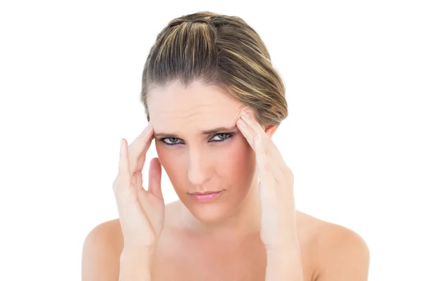 Portrait of upset woman with a headache — Stock Photo, Image