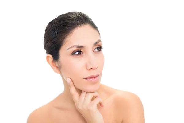 Thoughtful brunette with finger on her face — Stock Photo, Image