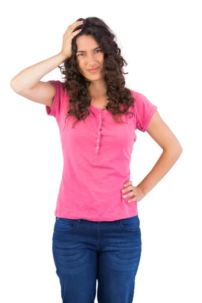 Cute brunette touching her head posing — Stock Photo, Image