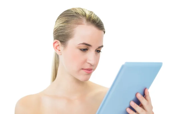 Content attractive blonde using tablet pc — Stock Photo, Image