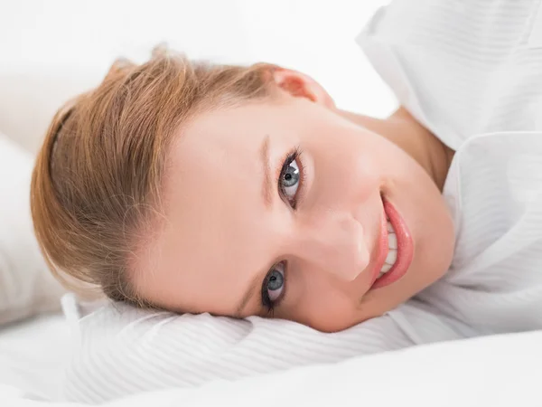 Calm pretty woman lying on her bed — Stock Photo, Image
