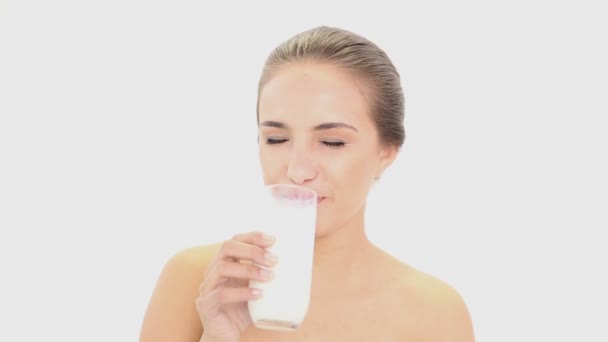 Beautiful model drinking glass of milk — Stock Video