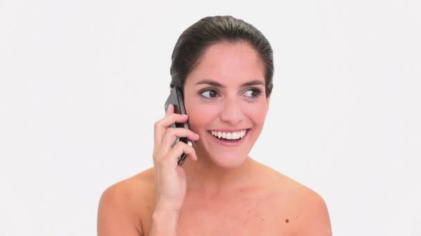 Amused brunette woman making a phone call — Stock Video