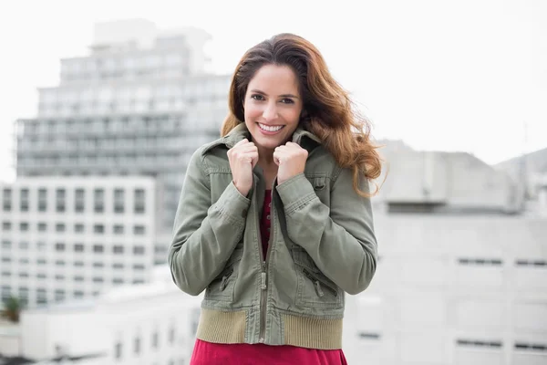 Brunette in winter fashion grabbing collar — Stock Photo, Image