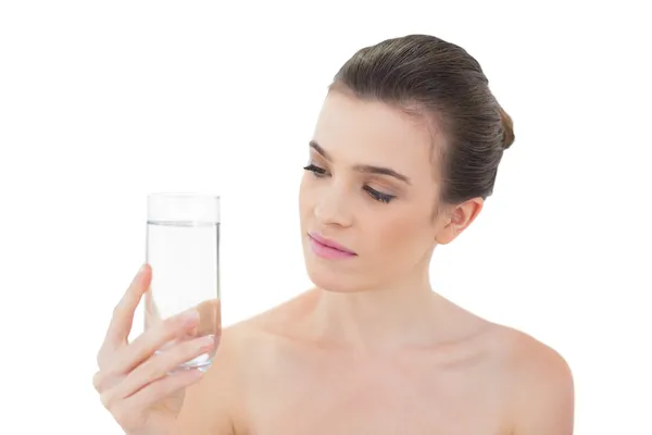 Peaceful model looking at a glass of water — Stock Photo, Image