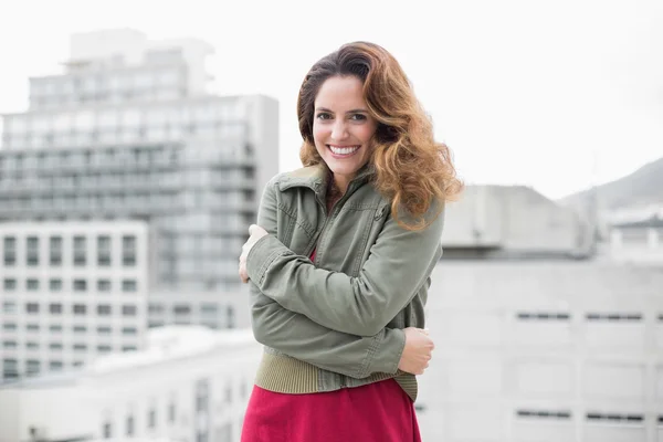 Brunette in winter fashion standing keeping warm — Stock Photo, Image