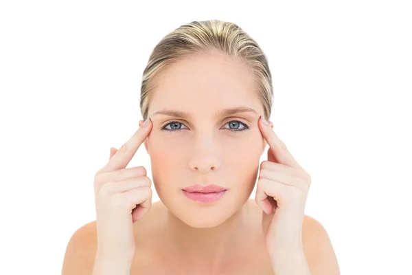 Thinking fresh blonde woman touching her temples — Stock Photo, Image