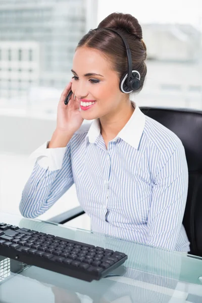 Happy businesswoman using headset — Stock Photo, Image