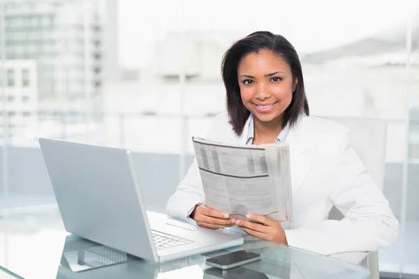 Cheerful young businesswoman holding a document — Stock Photo, Image