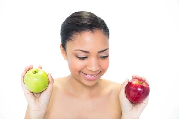 Seductive young dark haired model holding apples — Stock Photo, Image